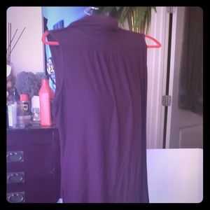 Sleeveless cowl neck top.